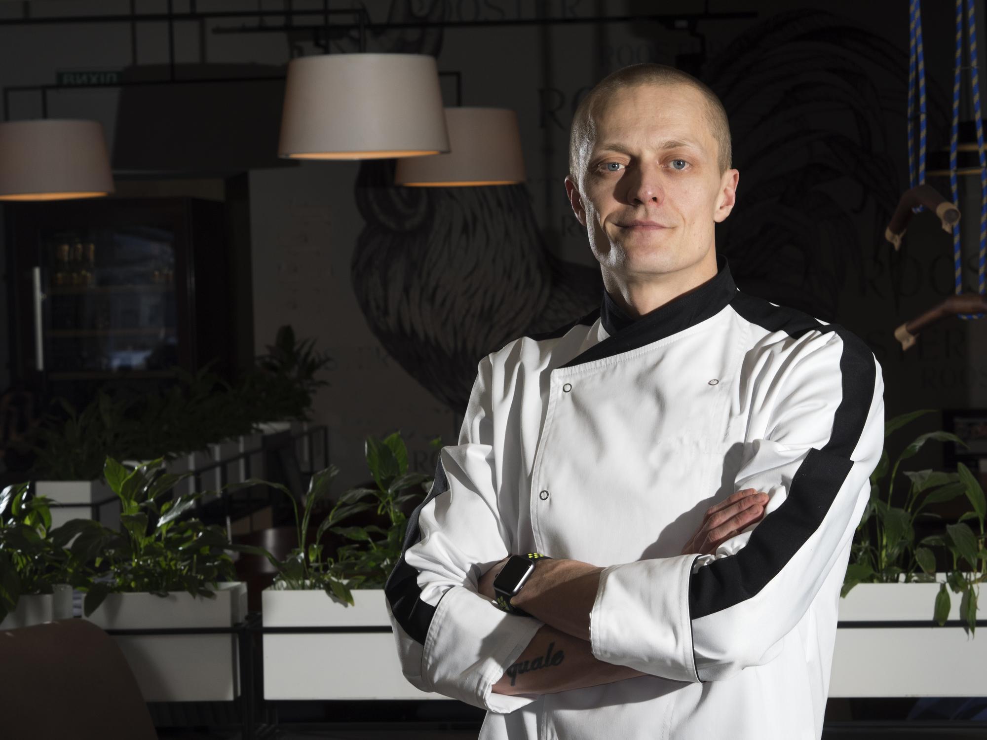 Head chef portrait with modern kitchen background